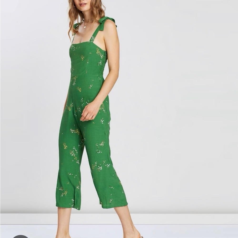 FAITHFULL THE BRAND: Elsa shoulder tie jumpsuit in green.